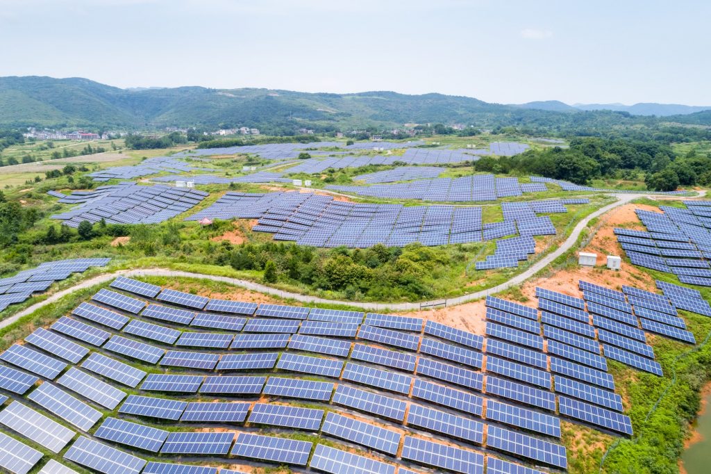 solar power station on hillside, aerial view of renewable energy